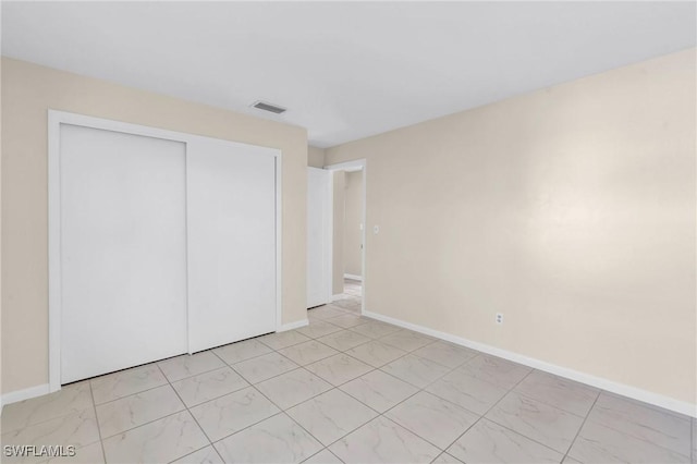 unfurnished bedroom featuring a closet