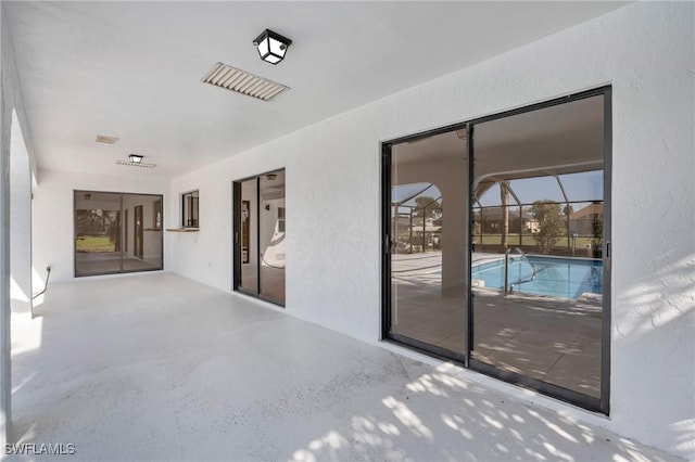 view of patio / terrace with a lanai