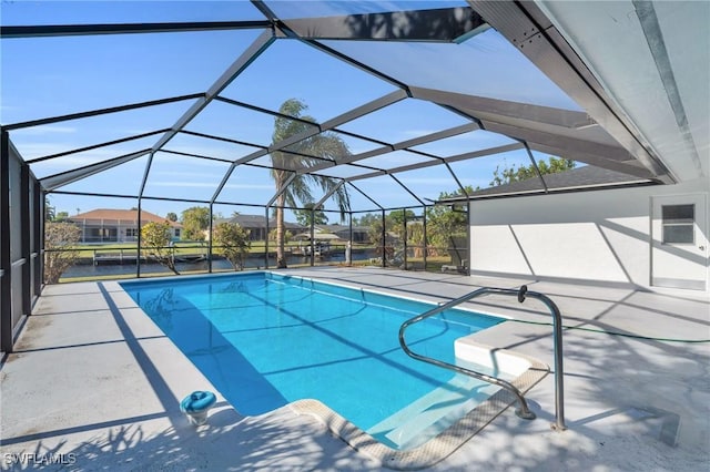 view of swimming pool with a lanai and a patio area