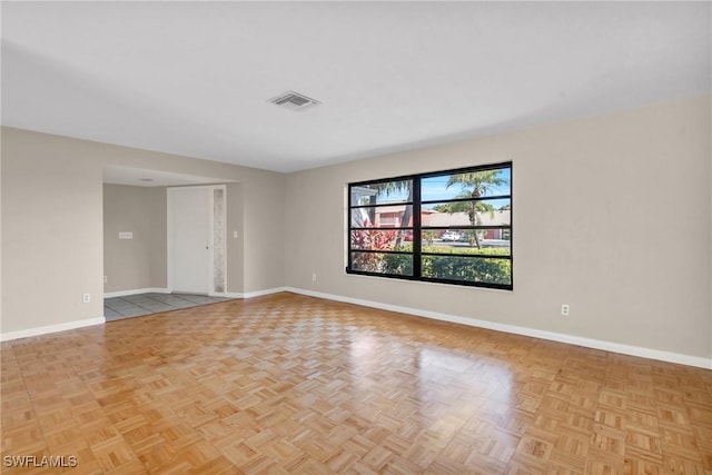 spare room with light parquet flooring