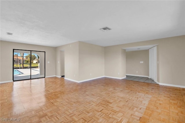 spare room featuring light parquet flooring