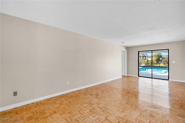 spare room featuring light parquet floors