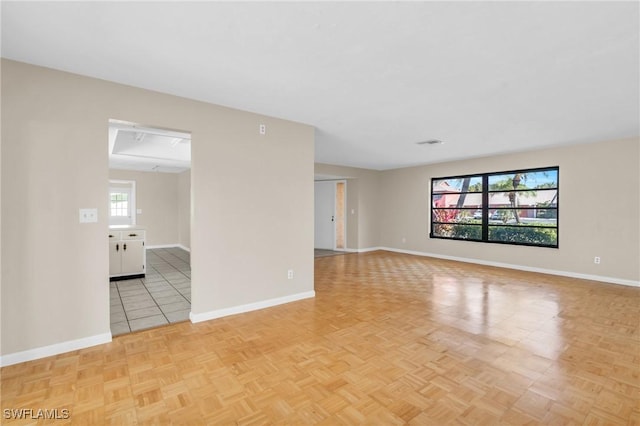 spare room with light parquet flooring