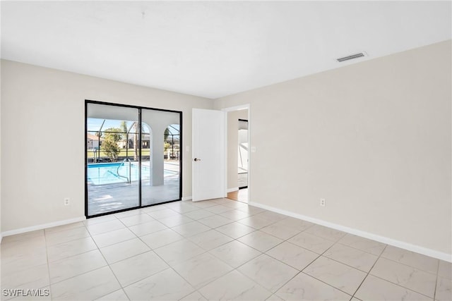 empty room featuring light tile patterned floors