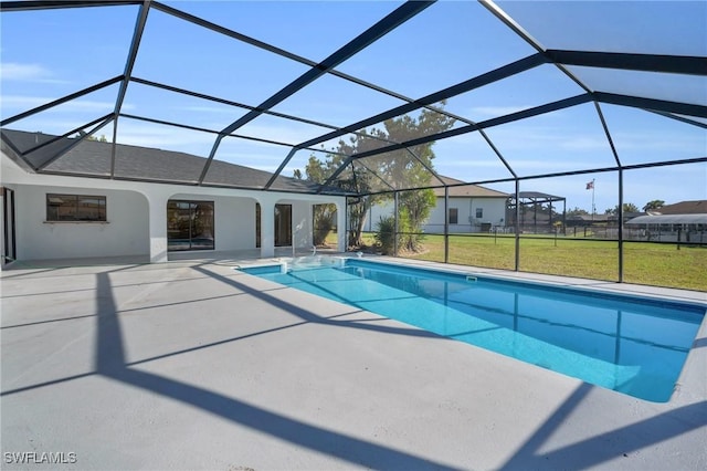 view of pool featuring a lanai, a lawn, and a patio