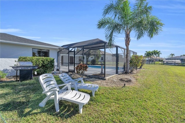 view of yard with glass enclosure