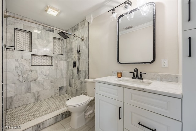 bathroom with a stall shower, visible vents, toilet, ornamental molding, and vanity