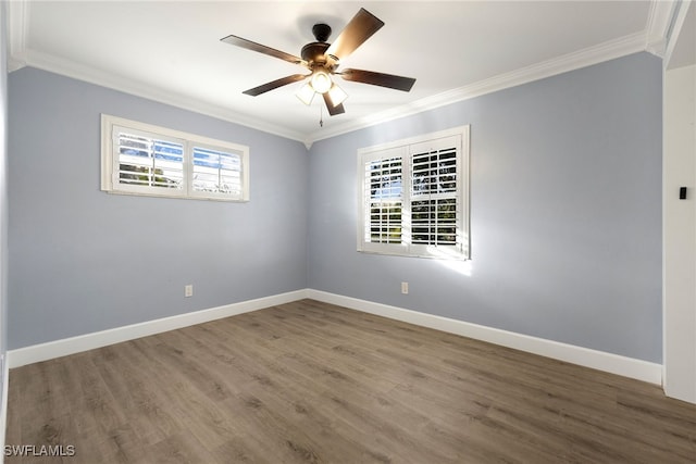 unfurnished room featuring ornamental molding and a wealth of natural light