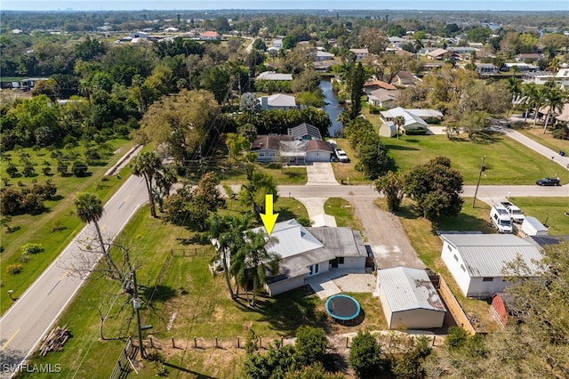 birds eye view of property with a residential view