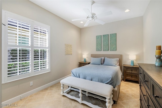 bedroom with ceiling fan and light tile patterned flooring