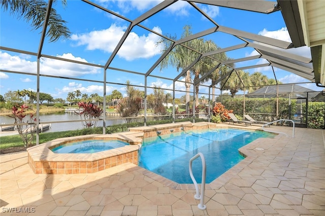 view of pool featuring an in ground hot tub, a patio area, a lanai, and a water view