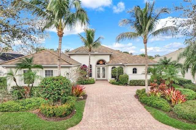 mediterranean / spanish home with french doors