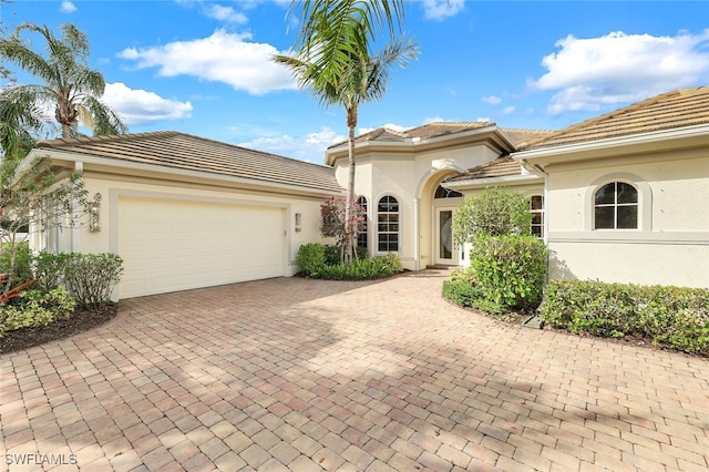 view of front of property with a garage