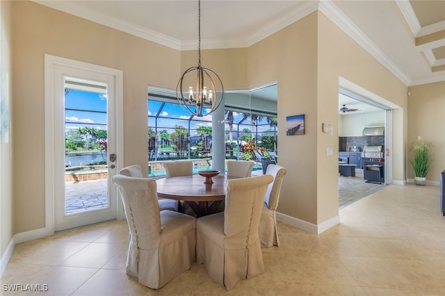 tiled dining area featuring a high ceiling, crown molding, and a chandelier