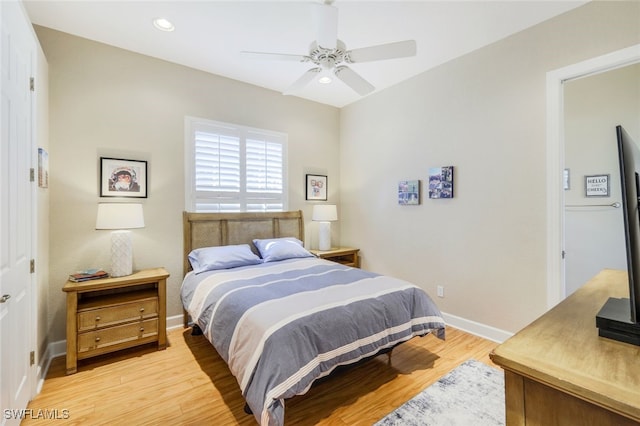 bedroom featuring light hardwood / wood-style floors and ceiling fan