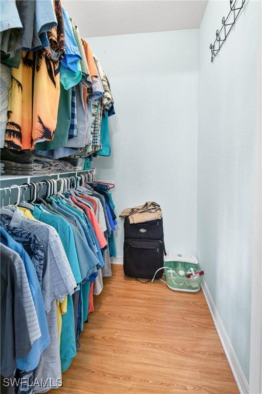 spacious closet with wood finished floors