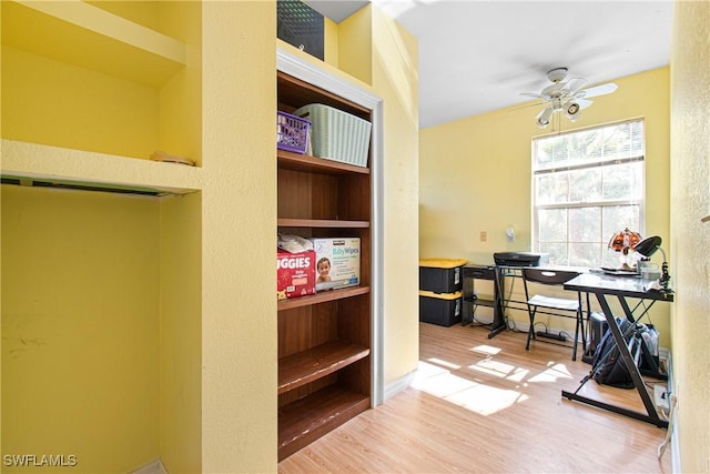 office area featuring wood finished floors and a ceiling fan