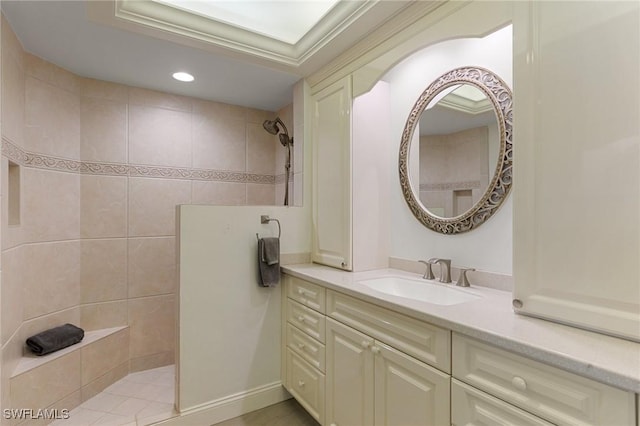 bathroom featuring vanity and tiled shower