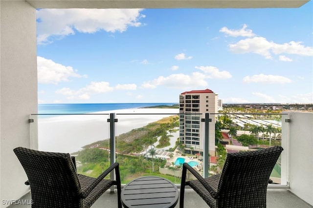 balcony featuring a water view