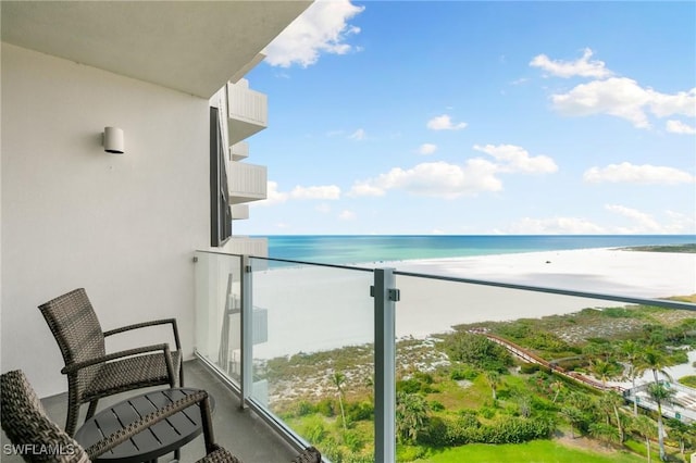 balcony with a view of the beach and a water view