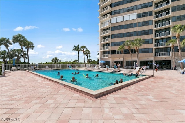 view of swimming pool with a patio area