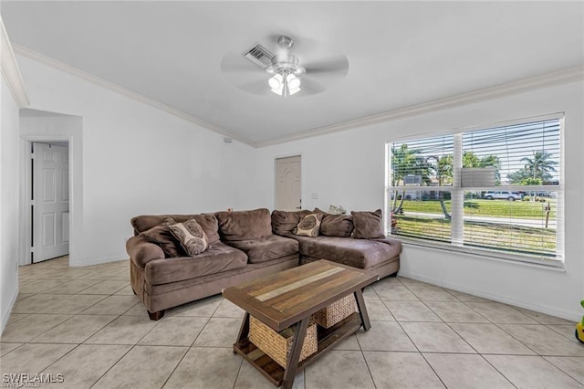 living room with crown molding, ceiling fan, and light tile patterned floors