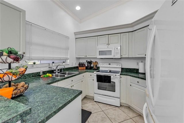 kitchen featuring sink, crown molding, white appliances, light tile patterned floors, and white cabinets