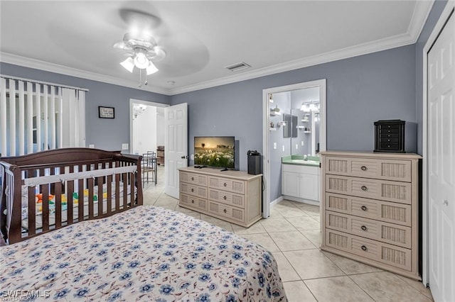 bedroom featuring sink, ornamental molding, light tile patterned floors, ceiling fan, and ensuite bath