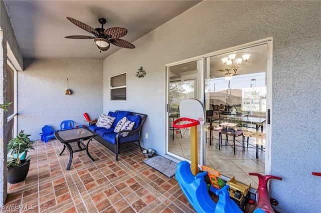 view of patio / terrace with ceiling fan and outdoor lounge area