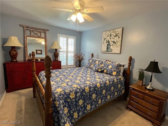 bedroom featuring light carpet and ceiling fan