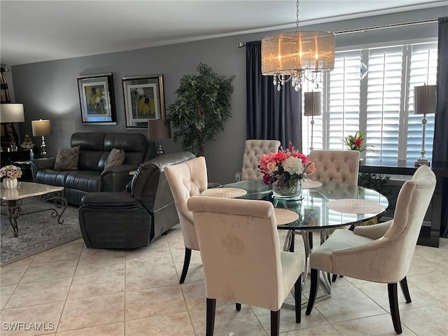 dining area with light tile patterned floors and a notable chandelier