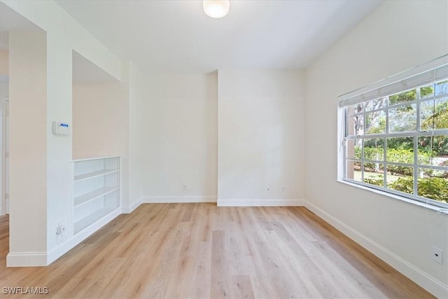 empty room with light hardwood / wood-style floors