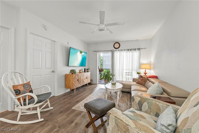 living room with hardwood / wood-style flooring and ceiling fan