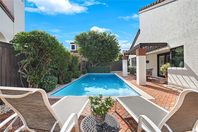 view of swimming pool featuring a patio