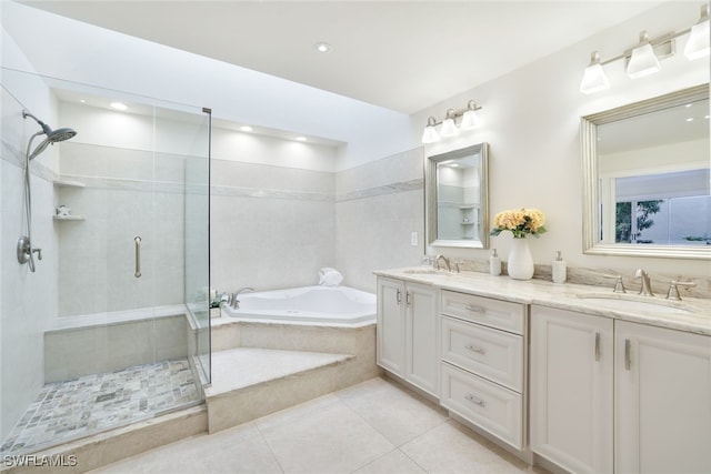 bathroom with tile patterned flooring, vanity, and separate shower and tub