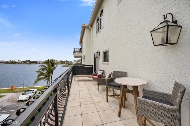 balcony featuring a water view