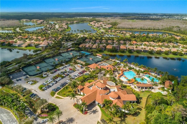 birds eye view of property with a residential view and a water view