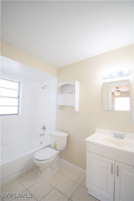 full bathroom with toilet, vanity, baseboards,  shower combination, and tile patterned floors