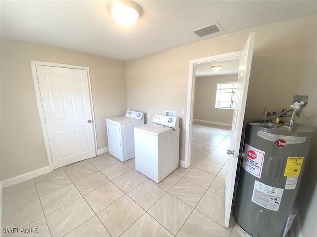 laundry area with laundry area, light tile patterned floors, visible vents, independent washer and dryer, and electric water heater