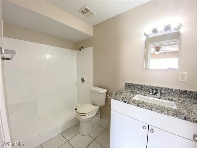 bathroom with toilet, a shower stall, visible vents, and vanity