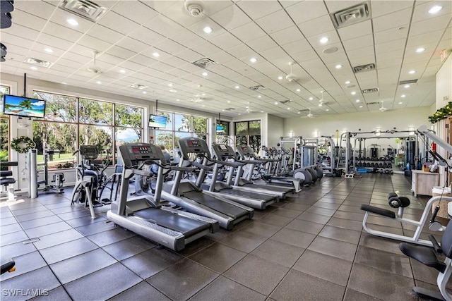 workout area featuring a drop ceiling