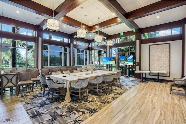 dining area with beamed ceiling, coffered ceiling, and hardwood / wood-style floors