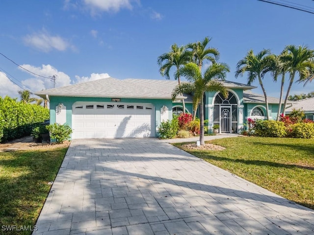 ranch-style home with a garage and a front yard