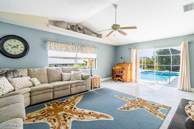 tiled living room featuring lofted ceiling, plenty of natural light, and ceiling fan