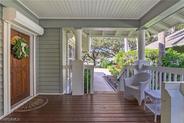 wooden deck featuring covered porch