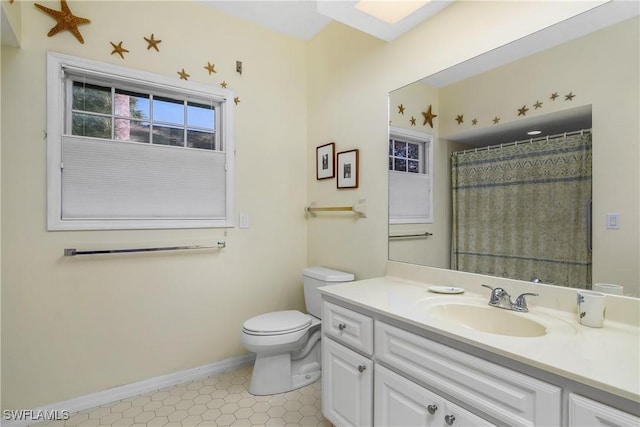 bathroom with vanity, a shower with curtain, and toilet