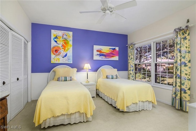 bedroom featuring carpet floors, a closet, and ceiling fan