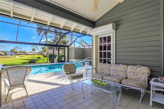 view of patio with ceiling fan, an outdoor hangout area, a pool with hot tub, and glass enclosure