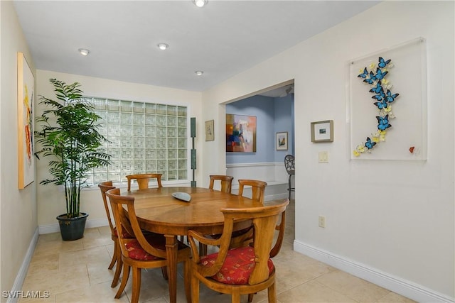 dining area with light tile patterned flooring