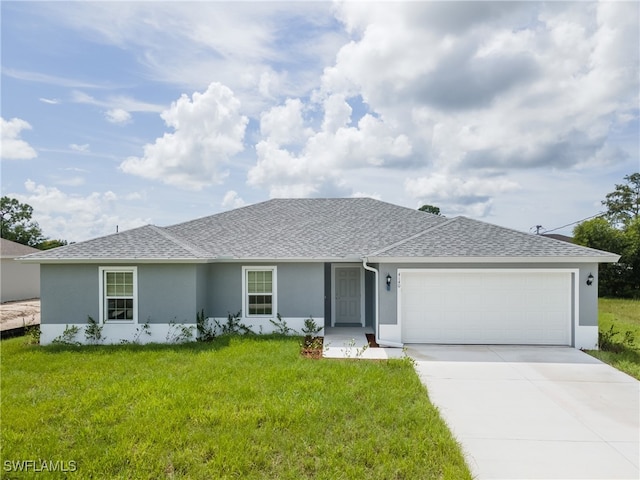 ranch-style home featuring a front yard, concrete driveway, roof with shingles, and stucco siding